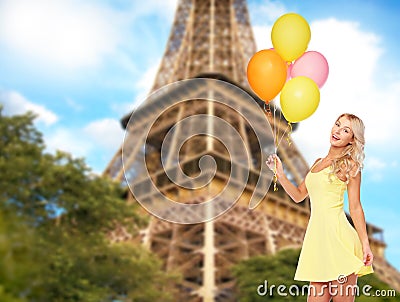 Happy woman with air balloons over eiffel tower Stock Photo