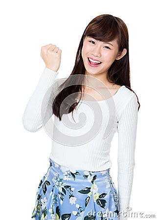 Happy woman with arm fist for encouragement Stock Photo