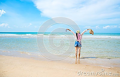 Happy woman on the beach Stock Photo