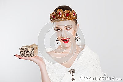 Happy woman beauty pageant contestant holding gift box Stock Photo