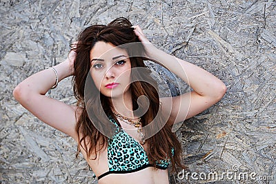 Happy woman in bikini posing on beach Stock Photo