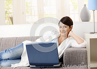 Happy woman browsing internet Stock Photo