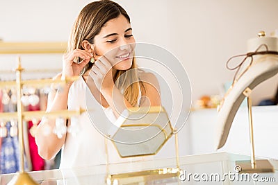 Happy woman buying some jewelry Stock Photo