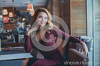 Happy Woman in Cafe. Cheerful Girl Stock Photo