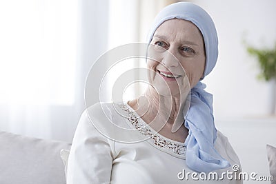 Happy woman in cancer headscarf Stock Photo