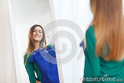 Happy woman choosing clothes at home wardrobe Stock Photo