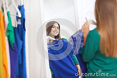 Happy woman choosing clothes at home wardrobe Stock Photo