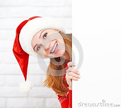 Happy woman at Christmas with blank empty white poster Stock Photo