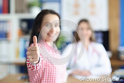 Happy woman in the doctor's office rejoices in recovery Stock Photo