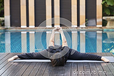 Happy woman doing yoga exercises Editorial Stock Photo