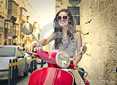 Happy woman driving a mopped Stock Photo