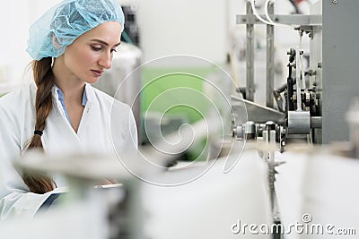 Happy woman employee working as manufacturing engineer in factor Stock Photo