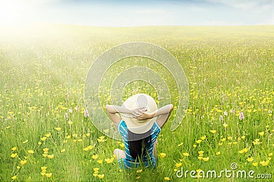 Happy woman enjoy springtime on meadow Stock Photo