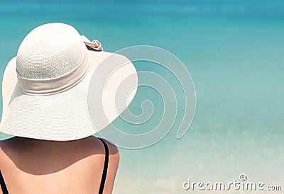 Happy woman enjoying beach relaxing joyful in summer by tropical blue water. Beautiful bikini model happy on travel wearing beach Stock Photo