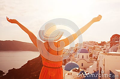 Happy woman enjoying her holidays on Santorini, Greece Stock Photo