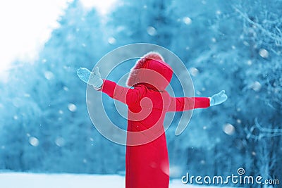 Happy woman enjoying winter snowy weather outdoors, season Stock Photo