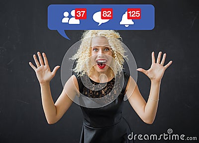 Happy woman excited about notifications on social media Stock Photo