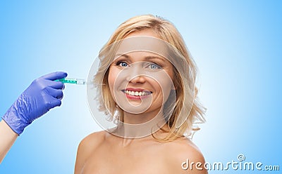 Happy woman face and beautician hand with syringe Stock Photo