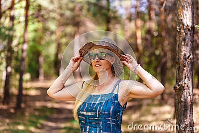Happy woman of fifty years in a hat Stock Photo