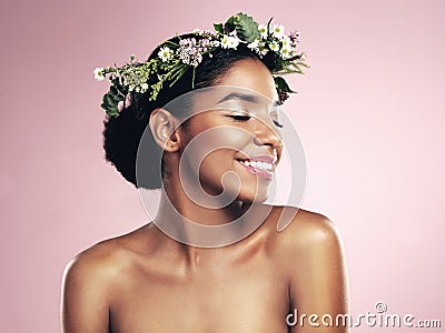 Happy woman, flower crown in hair for beauty in studio, pink background and natural skincare. African face, female model Stock Photo