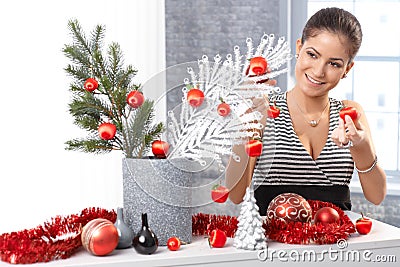 Happy woman getting ready for christmas Stock Photo