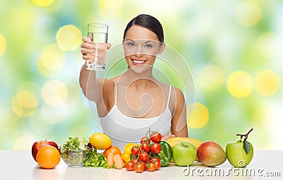 Happy woman with healthy food showing water glass Stock Photo