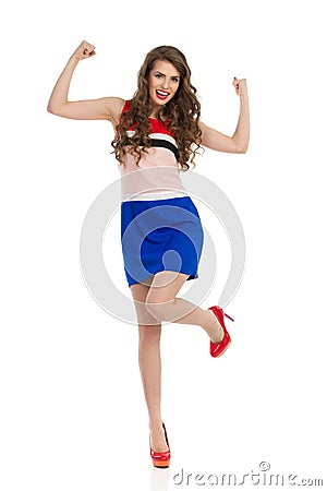 Happy Woman In High Heels And Mini Dress Cheering Stock Photo