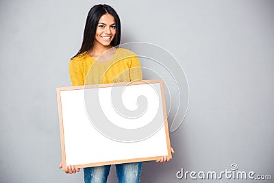 Happy woman holding blank board Stock Photo