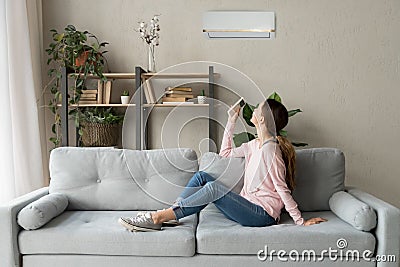 Happy woman holding cooler system remote controller enjoy fresh air Stock Photo