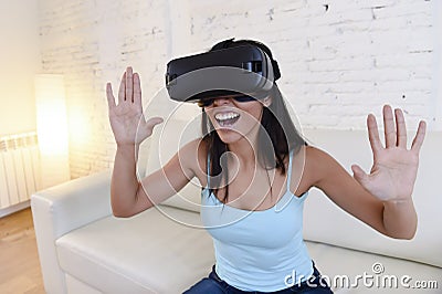 Happy woman at home living room sofa couch excited using 3d goggles watching 360 virtual reality Stock Photo