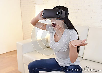 Happy woman at home living room sofa couch excited using 3d goggles watching 360 virtual reality Stock Photo