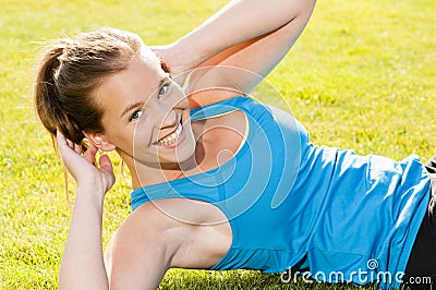 Happy woman jogger training in the park