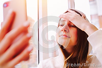 Happy woman laughing having online video call with friends or family smartphone Stock Photo