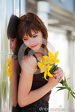 Happy fashion woman with a flowers daydreaming Stock Photo