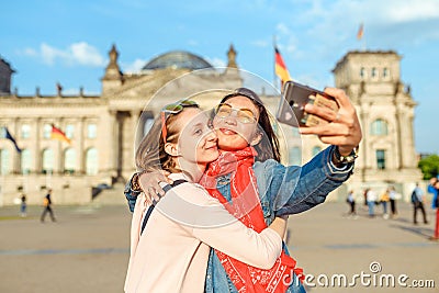 Happy woman making selfie on background of Reichstag Bundestag building in Berlin. Travel and love concept in Europe Stock Photo