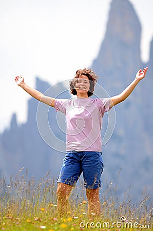 Happy woman in mountains Stock Photo