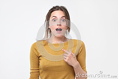 Happy woman pointing fingers at herself. Select me please concept. Stock Photo