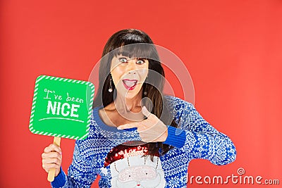Happy woman pointing to a nice sign Stock Photo