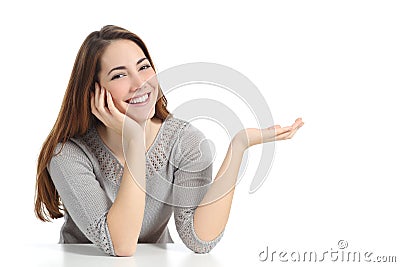 Happy woman presenting with open hand holding something blank Stock Photo