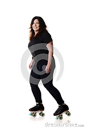 Happy woman roller skating Stock Photo