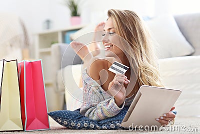 Happy woman shopping online with credit card Stock Photo