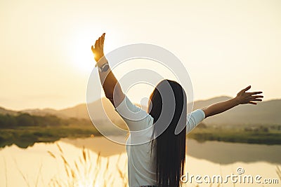 Happy woman spreading arms and watching the mountain. Travel Lifestyle success concept adventure active vacations outdoor freedom Stock Photo