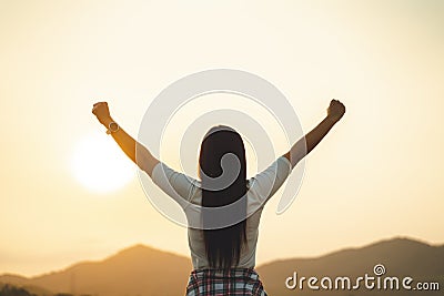 Happy woman spreading arms and watching the mountain. Travel Lifestyle success concept adventure active vacations outdoor freedom Stock Photo