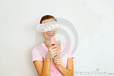 Happy Woman standing againtst wall Stock Photo