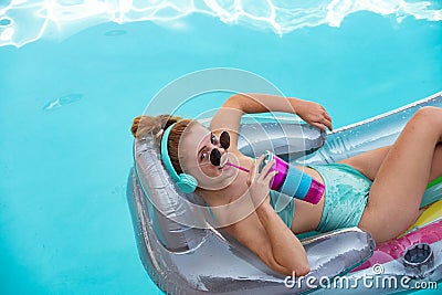 Happy woman summer vacation. Girl in swimmsuit. Summer lady on inflatable mattress. Stock Photo