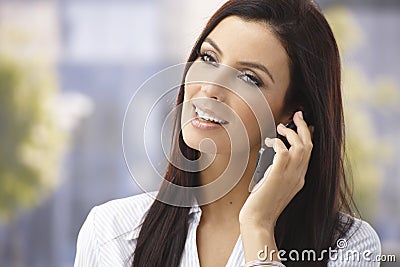 Happy woman on mobilephone Stock Photo