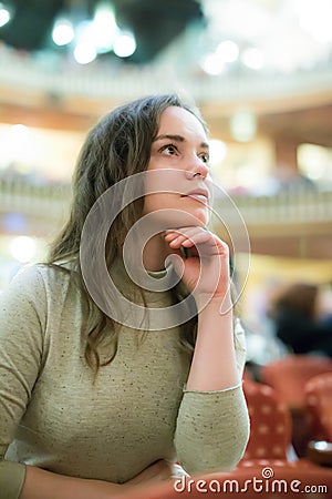 Happy woman theatre goer looking at play Stock Photo