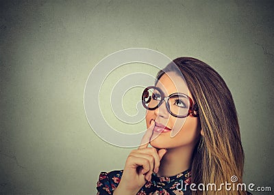 Happy woman thinking looking up Stock Photo
