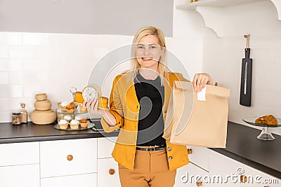Happy Woman Unpacking On Line Purchase At Home Stock Photo