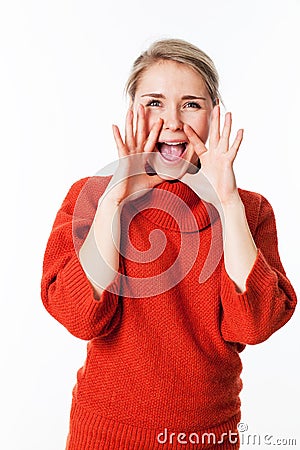 Happy woman using hands as megaphone to communicate Stock Photo